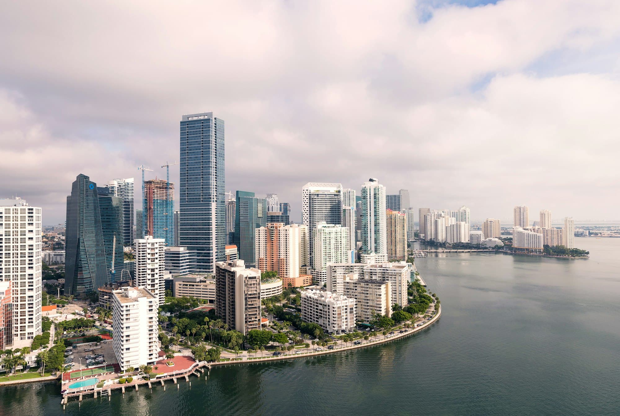 A beachfront skyline where a traveller compares eSIM and SIM